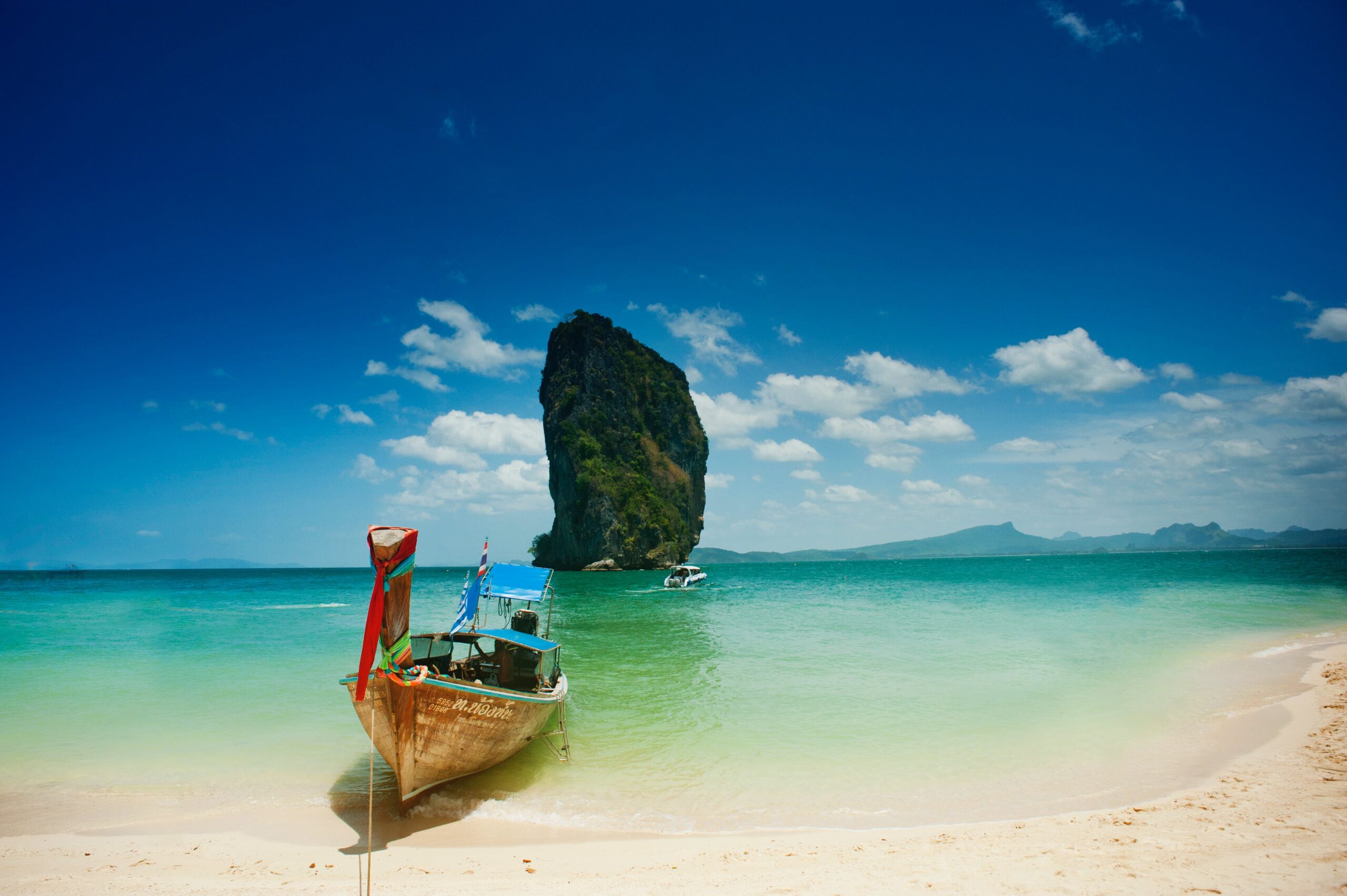 Thailand beach with a longtail boat